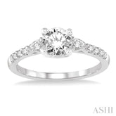 7/8 Ctw Pear and Round Cut Diamond Engagement Ring With 1/2 Ct Round Cut Center Stone in 14K White Gold