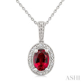 7X5 MM Oval Shape Lab-Created Ruby and 1/50 Ctw Round Cut Diamond Precious Pendant With Chain in Sterling Silver