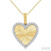1/4 Ctw Fluted Texture Heart Round Cut Diamond Fashion Pendant With Chain in 10K Yellow and White Gold
