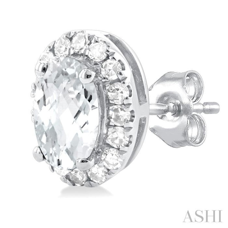 5x3 MM Oval Shape White Topaz and 1/8 Ctw Single Cut Diamond Halo Semi-Precious Stud Earrings in 10K White Gold