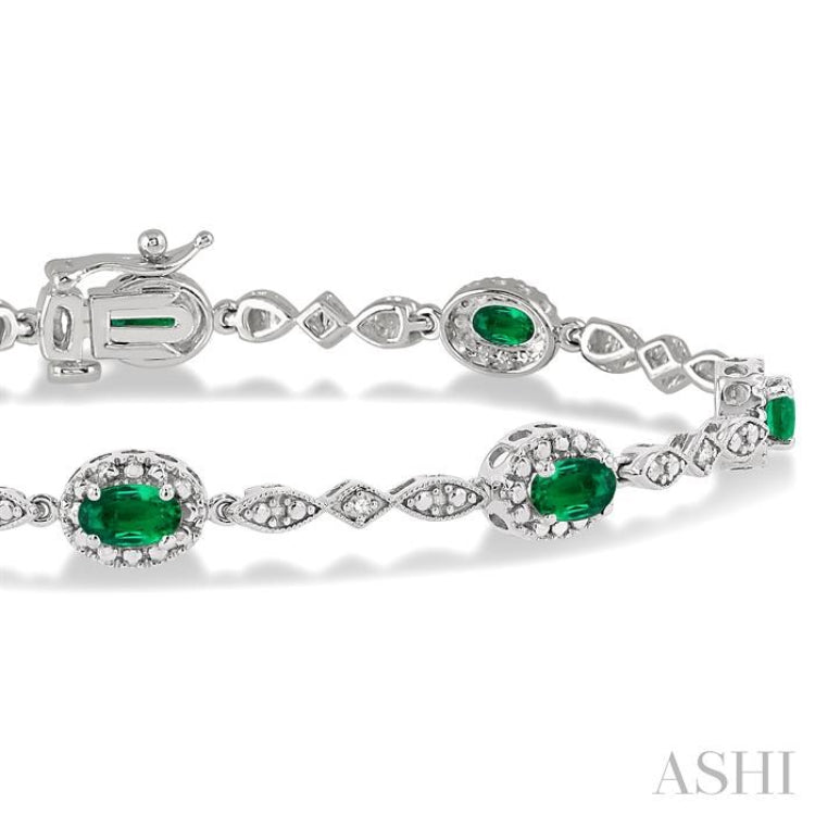 5x3 MM Oval Cut Emerald and 1/20 Ctw Single Cut Diamond Bracelet in 10K White Gold