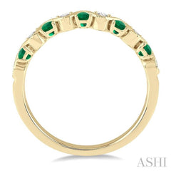 1.8 MM Emerald and 1/6 ctw Round Cut Diamond Precious Waves Wedding Band in 14K Yellow Gold