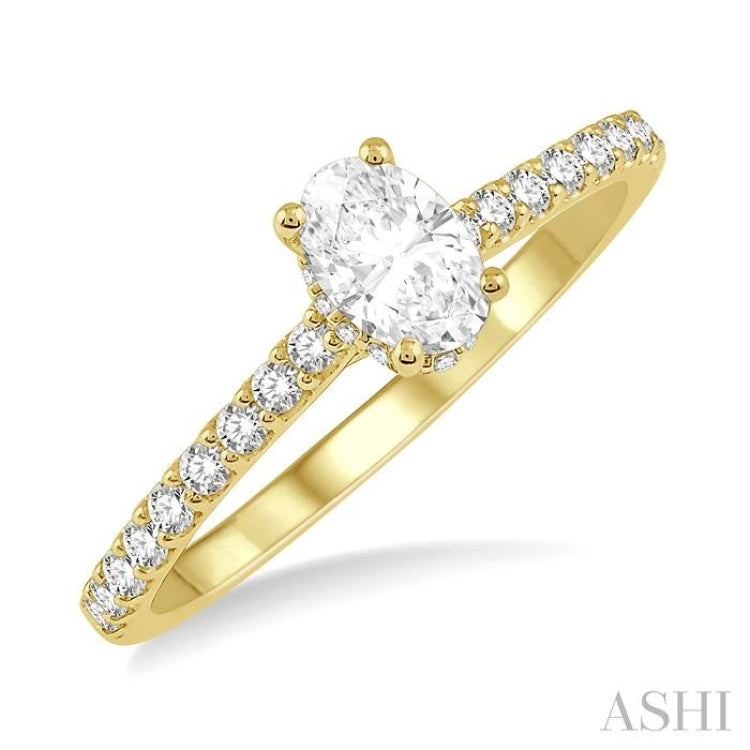 1/2 Ctw Round Cut Diamond Engagement Ring With 1/4 ct Oval Cut Center Stone in 14K Yellow Gold