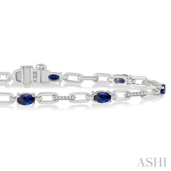 1/6 Ctw Round Cut Diamond & 5x3 MM Oval Cut Sapphire Precious Bracelet in 10K White Gold