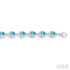 1/10 Ctw Round Cut Diamond & 6x4 MM Oval Cut Blue Topaz Semi Precious Bracelet in Sterling Silver